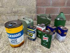 A collection of assorted oil cans etc.