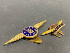 An Aeroshell part enamel lapel badge and a second for Heppolite.