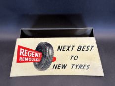 A Regent remould garage tyre display stand.