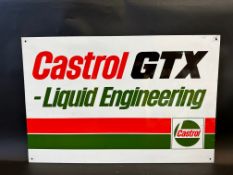 A Castrol GTX tin advertising sign, appears new old stock, 24 x 16".