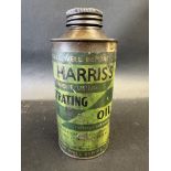 A Harris's Penetrating Oil cylindrical tin with paper label.