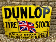 A large Dunlop Tyre Stock enamel sign with garage name Gould Bros Ltd. 4 & 5 Southernhay, Exeter, 72