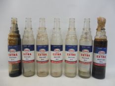 Seven Esso Extra Motor Oil quart glass bottles.