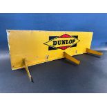 A Dunlop tin advertising sign/rack with three brackets, 27 1/2 x 7 1/2".