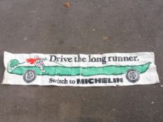 A Michelin 'Drive The Long Runner' advertising banner, 94 x 20 1/2".