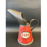 An Esso quart measure, dated 1951.