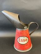 An Esso quart measure, dated 1951.