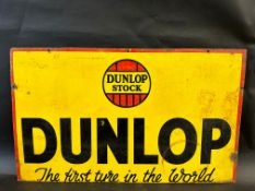 A Dunlop Stock rectangular enamel sign (trimmed along bottom edge), 30 x 18".