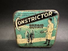 A Constrictor puncture repair outfit tin, with some contents.
