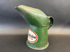 An Essolube Motor Oil pint measure, dated 1950.