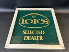 A Lotus double sided dealership sign.