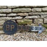 A BP 'To the Flying Ground' cardstock and printed paper directional arrow sign, 35 1/2 x 12".