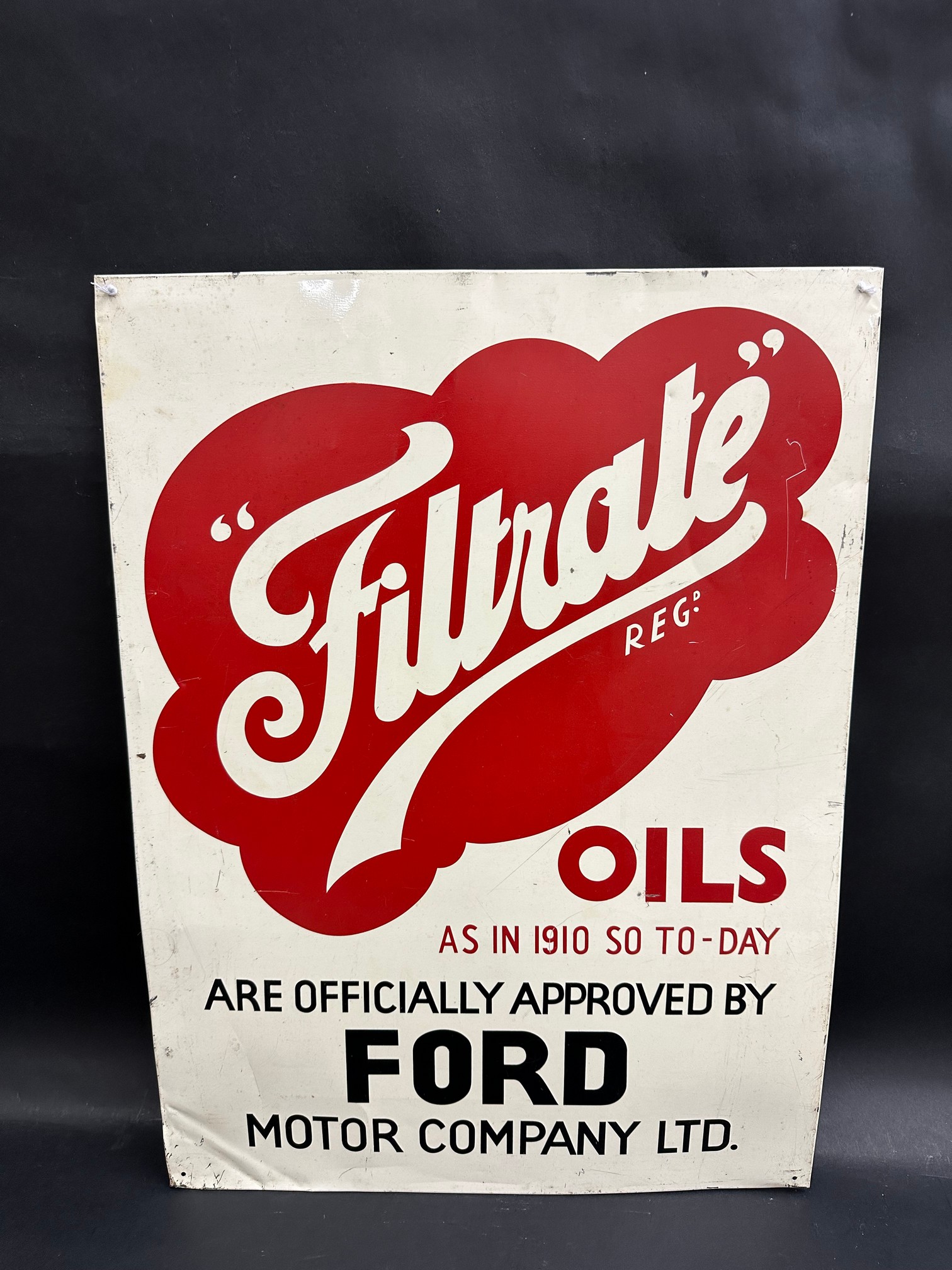 A Filtrate Oils 'Officially Approved by Ford' rectangular tin advertising sign, 18 x 24".