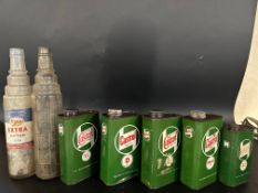 Four Castrol quart cans, a pint similar and two glass quart oil bottles.