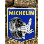 A small Michelin enamel sign with image of Mr Bibendum rolling a tyre, dated April 1965, 13 1/2 x