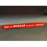 A 'Ride on Dunlop in Good Company' shelf strip.