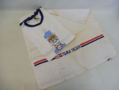 An Esso Team Tiger branded hand towel and a similarly branded t-shirt.