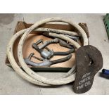 A canvas petrol pump hose, three nozzles etc.