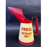 A Shell Rotella Oil quart measure.