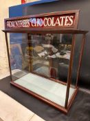 A Victorian/Edwardian mahogany counter top display cabinet with sliding doors to the rear and two