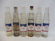Six Esso Extra Motor Oil pint oil bottles.