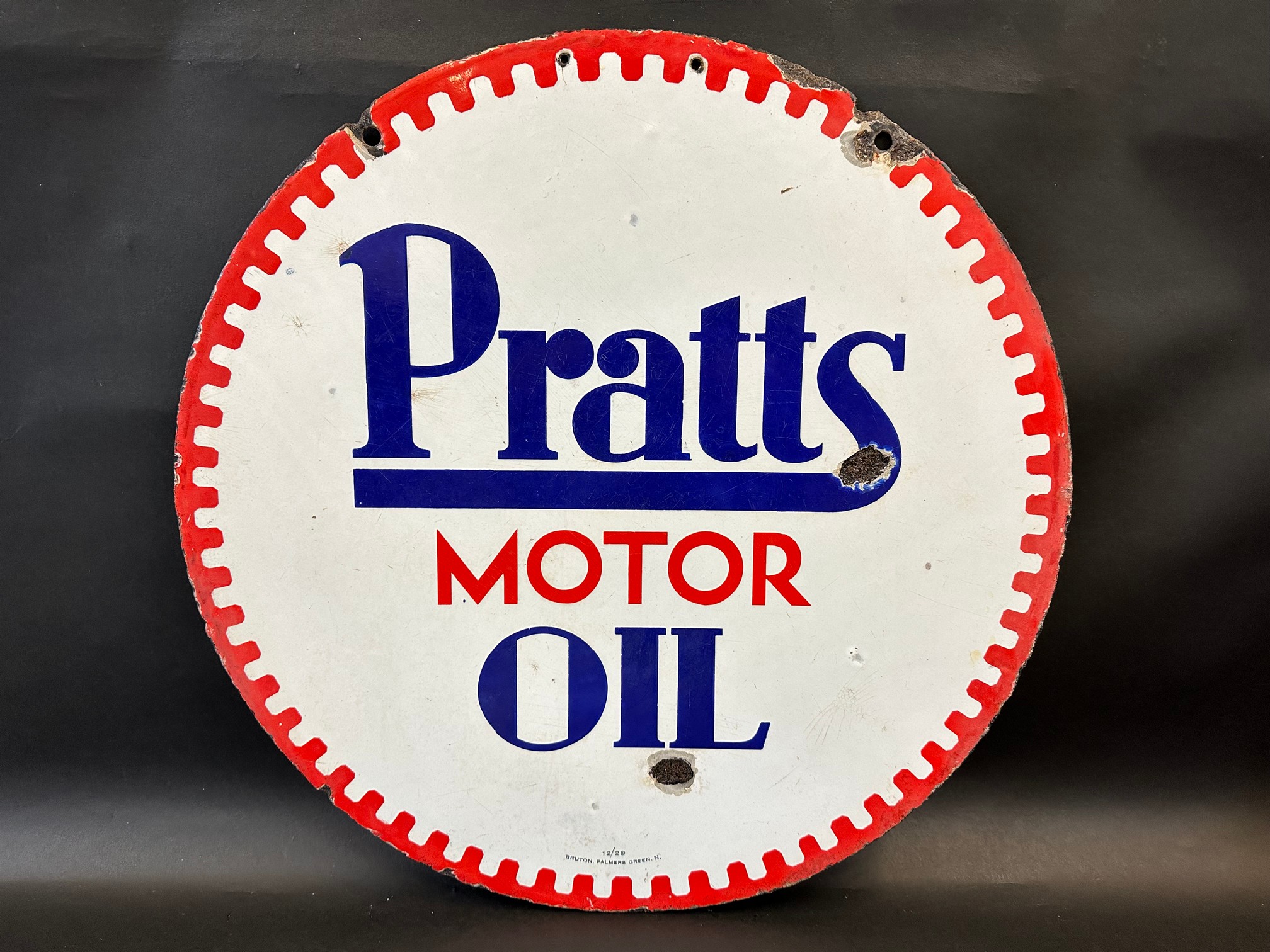 A Pratts Motor Oil circular double sided enamel sign by Bruton of Palmers Green, dated December