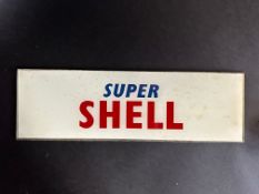 A small Super Shell glass petrol pump brand indicator, 12 1/2 x 3 3/4".