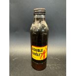 An early style Double Shell oil bottle with robotman/stickman motif to the label.