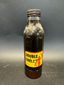 An early style Double Shell oil bottle with robotman/stickman motif to the label.