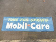A Mobil-Care advertising banner, 112 x 33".