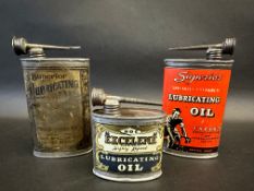 Two different version Superior Lubricating Oil oval cans, plus a smaller Excelene oval can.