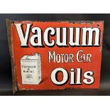 A Vacuum Motor Car Oils pictorial double sided enamel sign with hanging flange by Protector, some