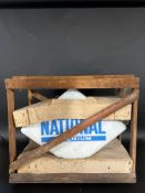 A National 'Premium' lozenge shaped glass petrol pump globe in original packing crate of issue.