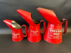 A graduated set of three Thelson Oils measures, half gallon to pint.