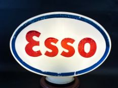 An Esso glass petrol pump globe, fully stamped underneath.