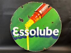 An Essolube circular double sided enamel sign with an image of oil pouring from a bottle, 26"