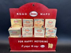 A 1950s Esso road maps garage display of maps.