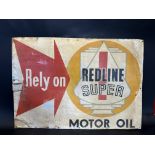 A rare Redline pictorial tin advertising sign.