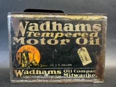 An early Wadhams Tempered Motor Oil rectangular oil can containing 1/2 US gallon.