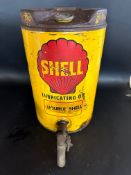 A Shell Lubricatring Oil five gallon drum with dispensing tap.