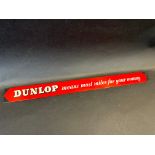 A Dunlop 'Most Miles for Your Money' shelf strip.