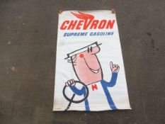 A large Chevron Supreme Gasoline advertising banner, 44 x 73 1/2".