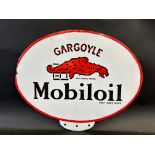 A Gargoyle Mobiloil oval double sided enamel pediment for an oil cabinet, some restoration near