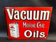 An early Vacuum Motor Car Oils double sided enamel sign with hanging flange, by Wildman and