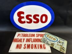 An oval Esso acrylic advertising sign, 23 1/2 x 16 1/2" plus two others.