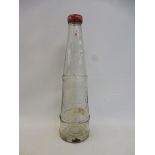 A Lobitol conical glass oil bottle.