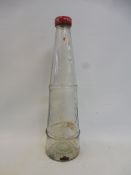 A Lobitol conical glass oil bottle.