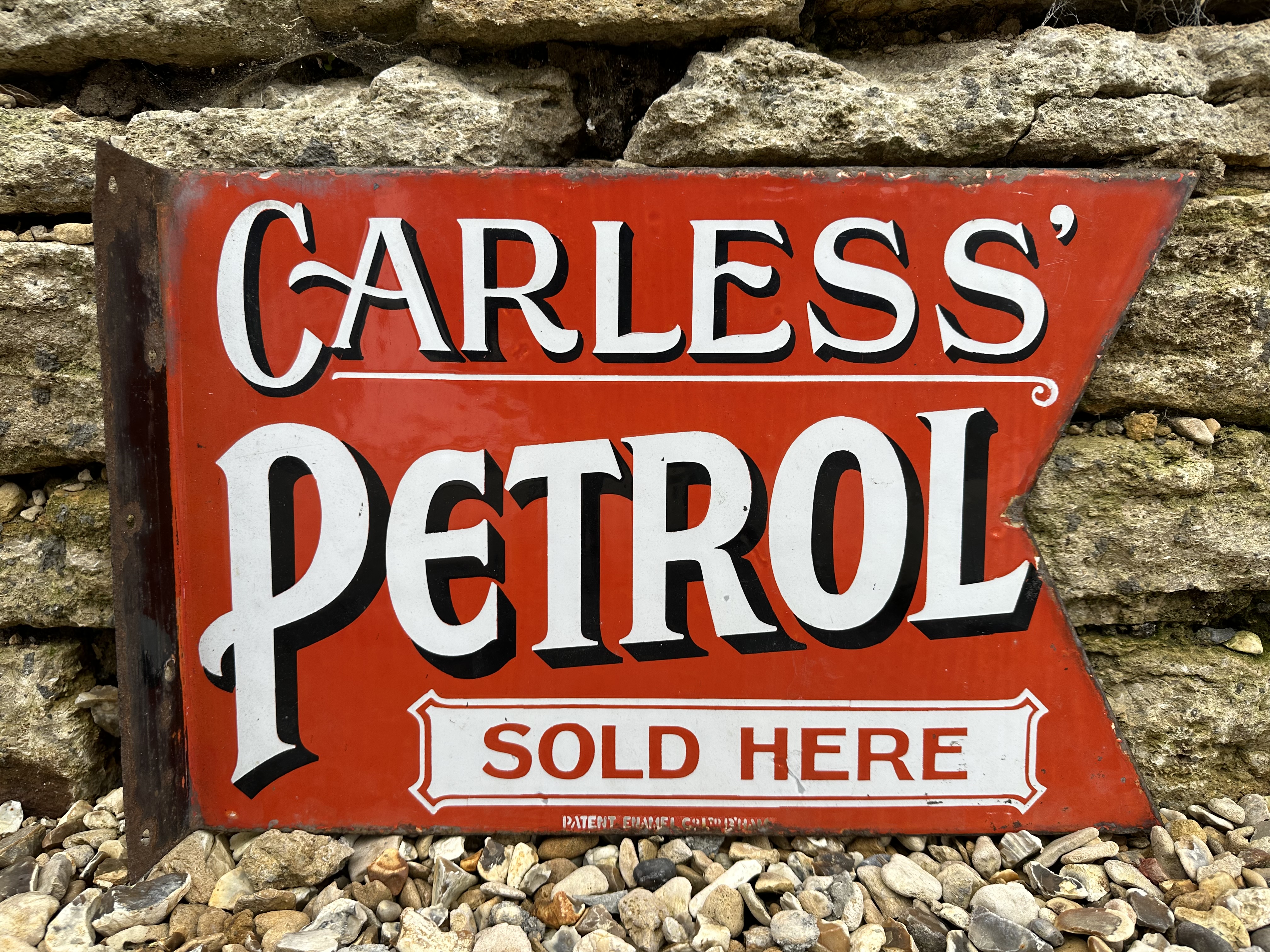 A rare Carless Petrol Sold Here double sided pennant enamel sign by Patent, with hanging flange,