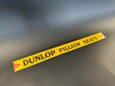 A Dunlop Pillion Seats shelf strip in good condition.