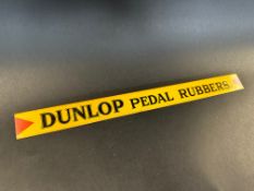 A Dunlop Pedal Rubbers shelf strip in good condition.